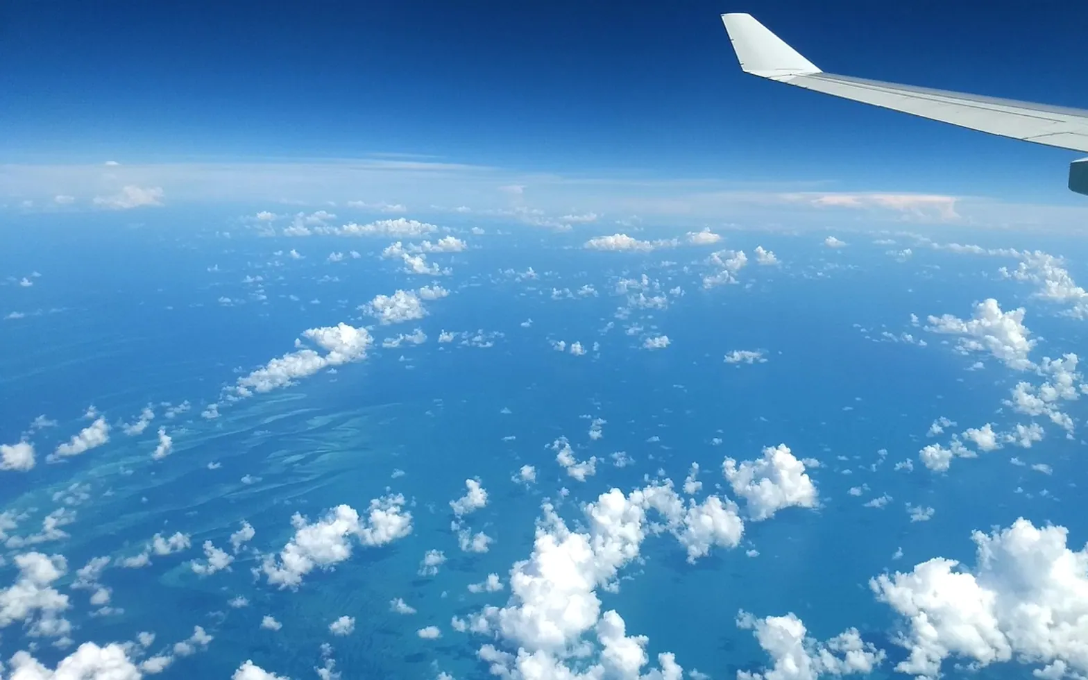 Sky, clouds and airplane wing