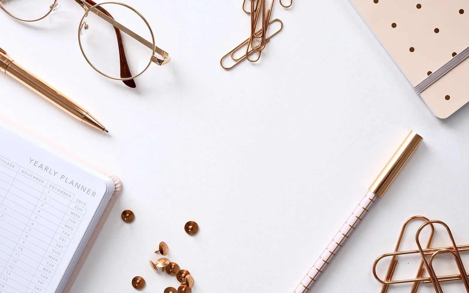 Notebook, desk and paper